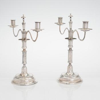 A pair of silver candelabra by Ferdinand Christian Krebs, Breslau, 1776-1792, with snuffers from Reval. Neo-classicism.