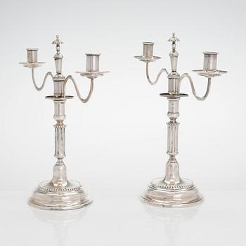 A pair of silver candelabra by Ferdinand Christian Krebs, Breslau, 1776-1792, with snuffers from Reval. Neo-classicism.