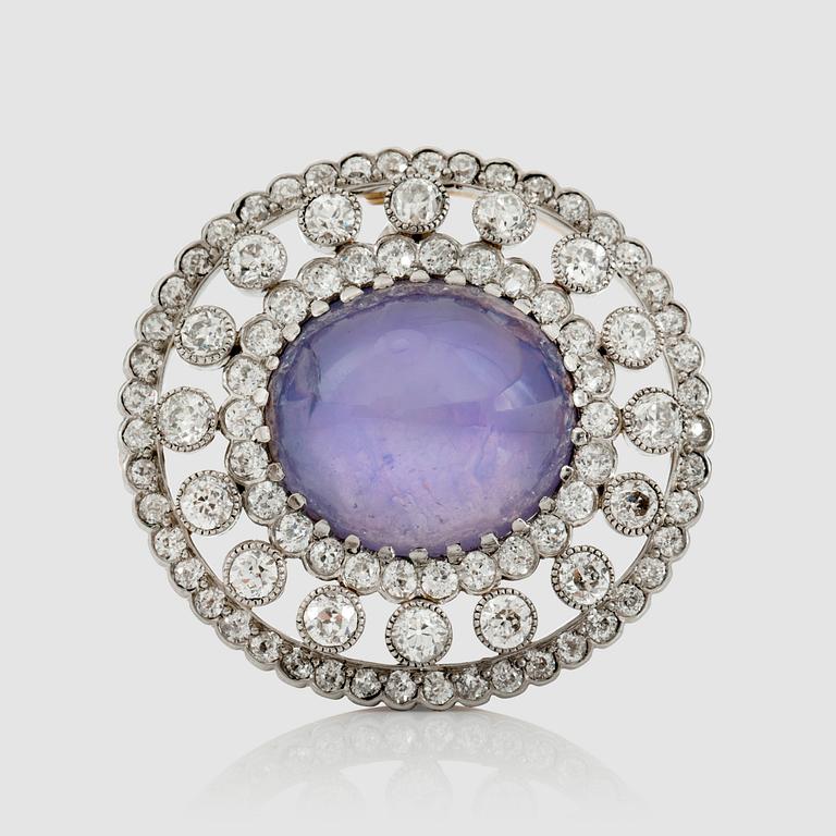 A natural untreated violet star sapphire and old-cut diamond brooch/pendant.