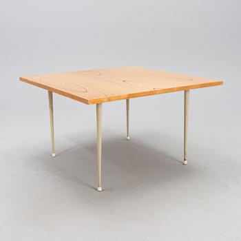 A coffee table marked Tapio Wirkkala, Asko, Made in Finland.