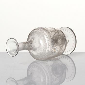 An engraved flask, circa 1800.