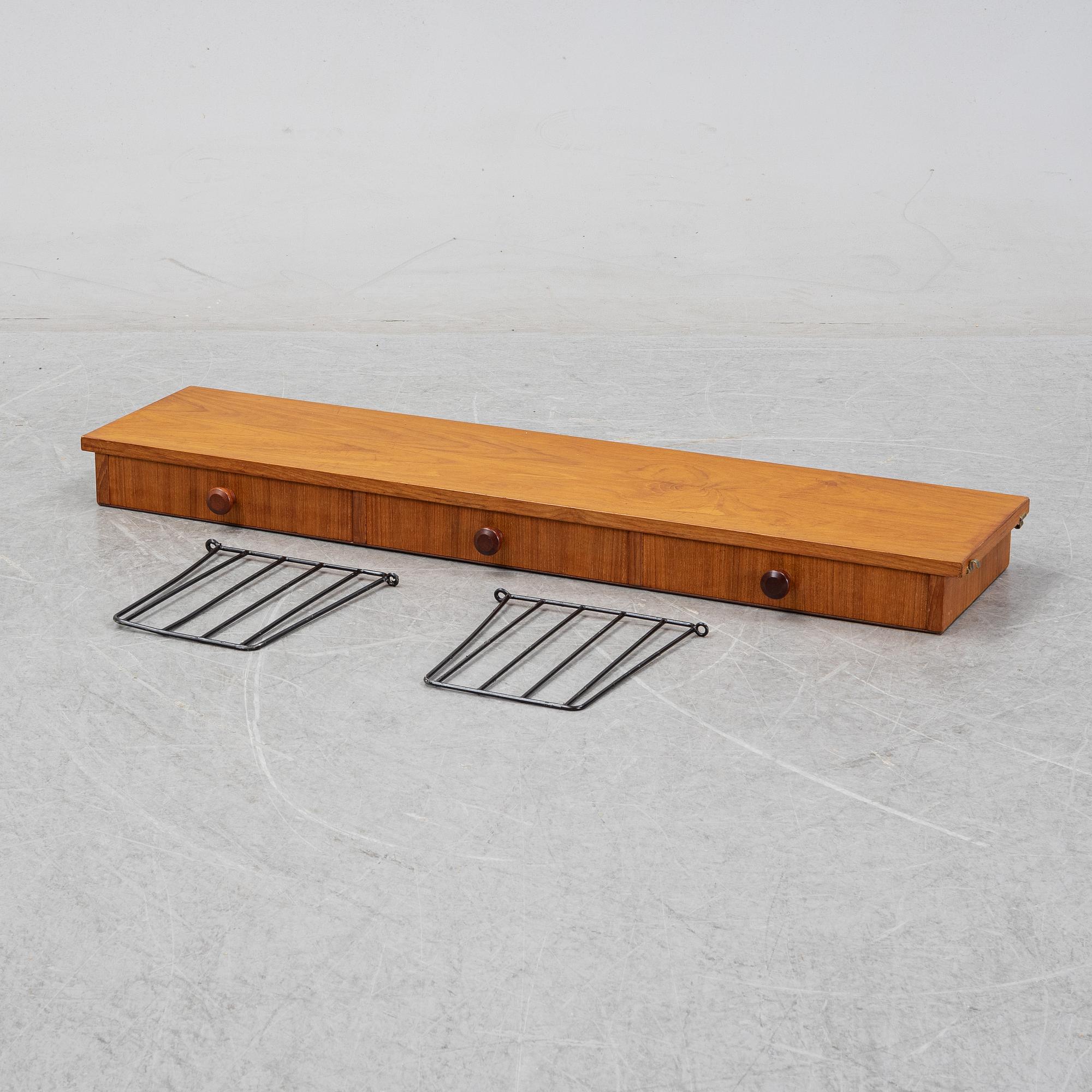 Nils Strinning, A 1950's-60's teak veneered shelf with brackets.