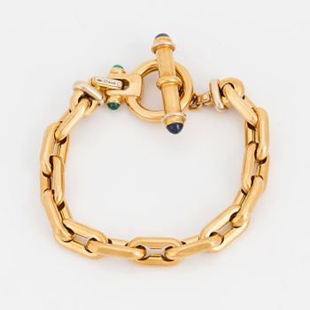 BRACELET, 18K gold, an anchor-link with cabochon rubies, sapphires and emeralds.