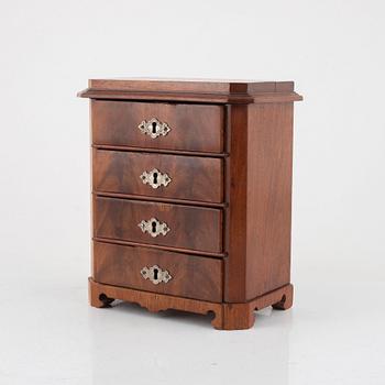 A mahogany miniature commode, later part of the 19th century.