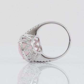 A rose quartz, circa 12.00 ct, and brilliant-cut diamond, circa 1.12 ct, ring.