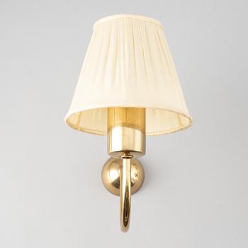 Three brass wall lamps, model 2335 and 2334, by Josef Frank, Firma Svenskt Tenn.