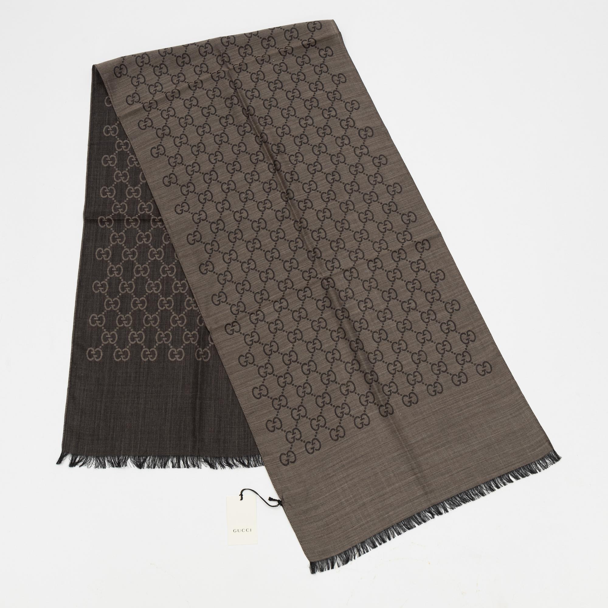 Gucci, a wool and silk mix "GG" jaquard shawl.