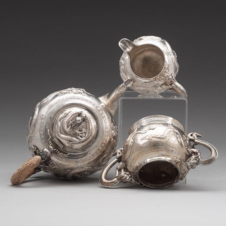 A Chinese three piece silver tea set, early 20th Century.