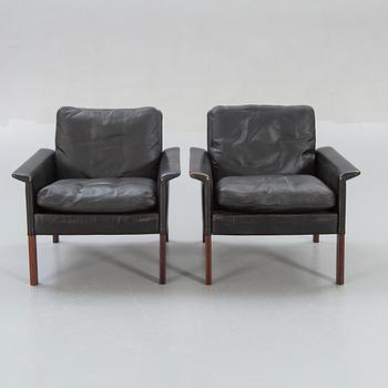 A pair of 1960s leather easy chairs.