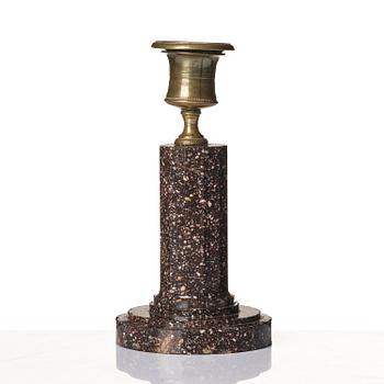An Empire 'Blyberg' porphyry candlestick from Älvdalen, first part 19th century.