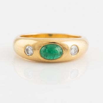 Cabochon cut emerald and brilliant cut diamond ring.