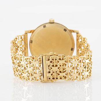 Omega, Genève, wristwatch, 14K gold, bracelet in 18K gold, 34.5 mm.