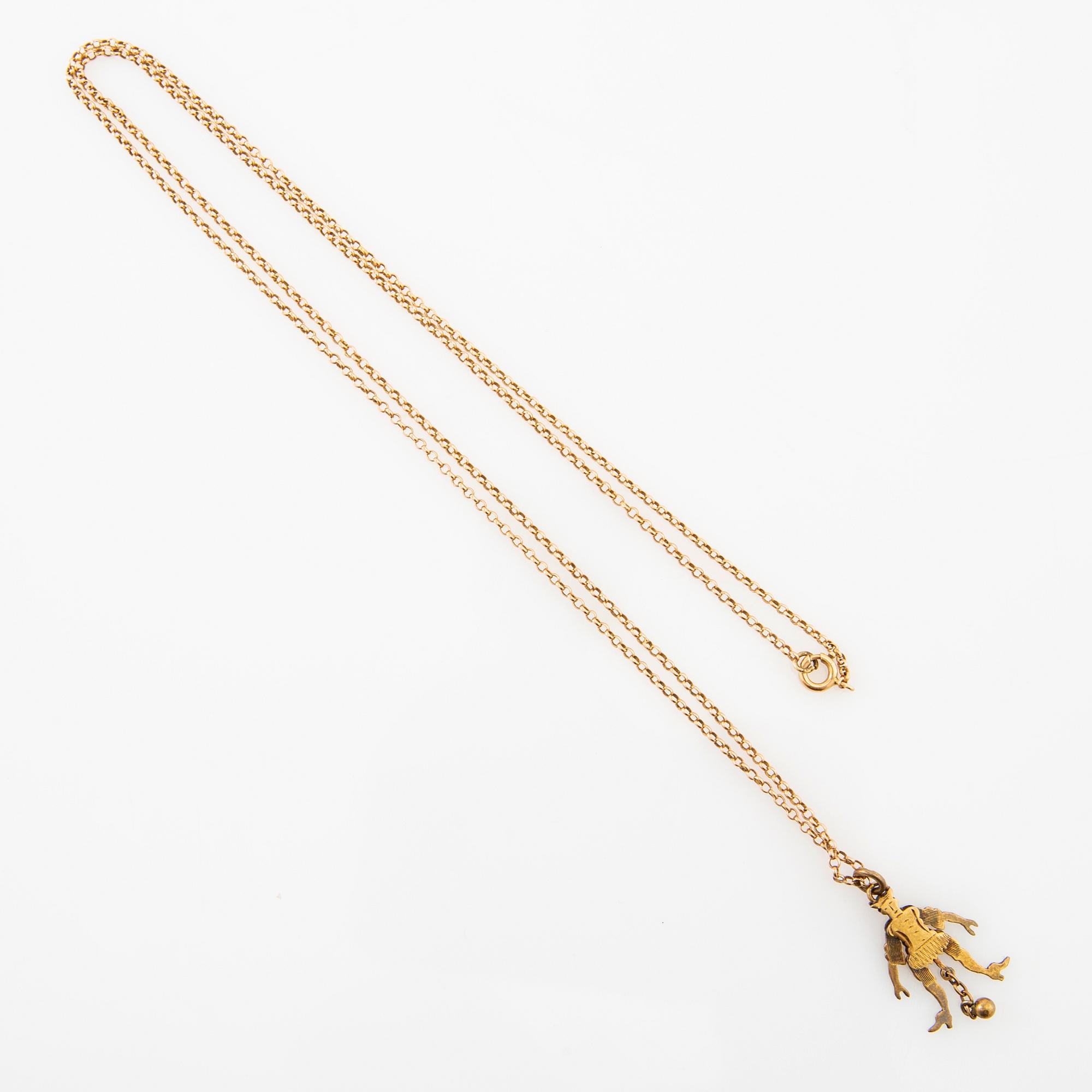 Halsband med kedja av 18K guld, hänge i form av en "sprattelgubbe" av 8K guld.