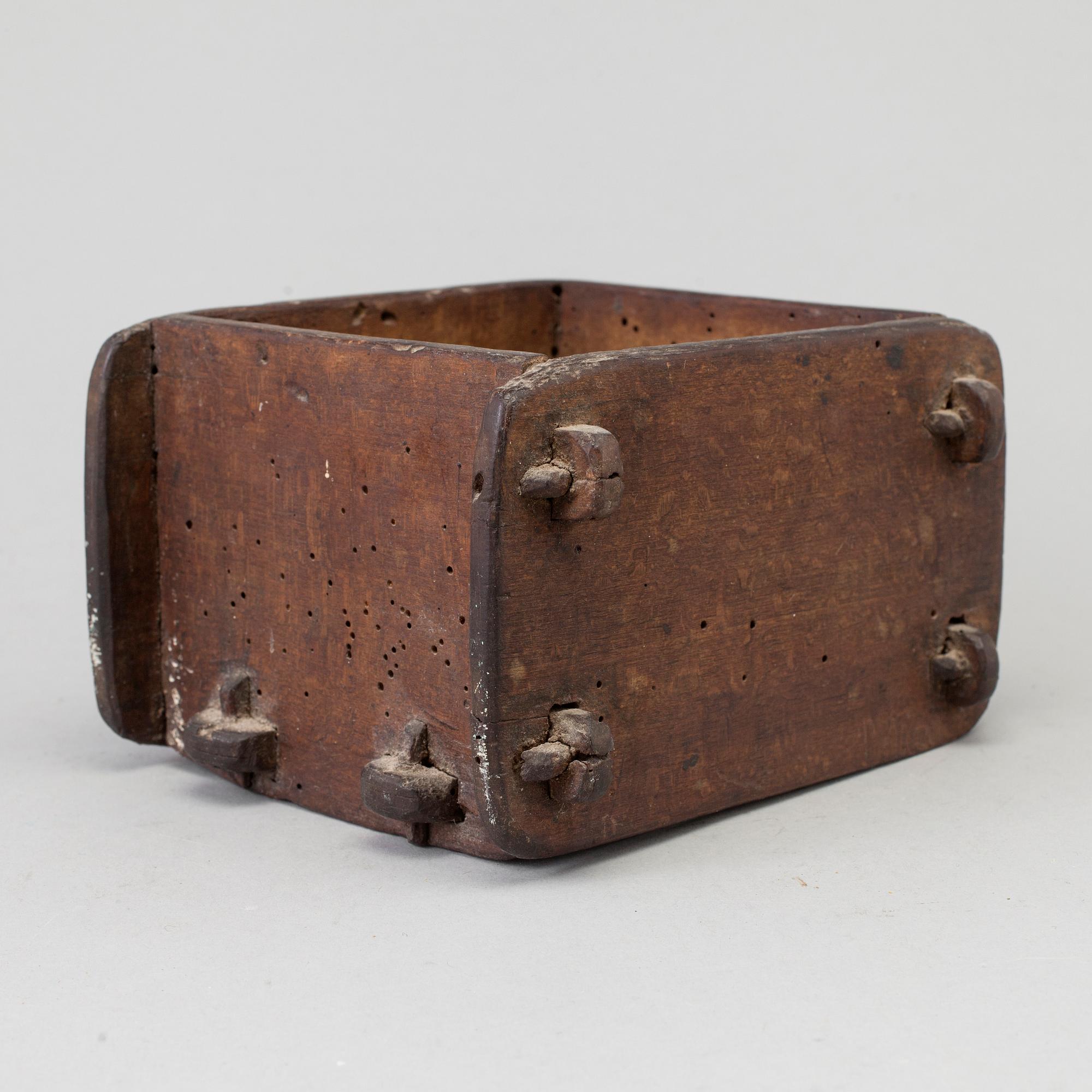 A cheese mould, dated 1768.