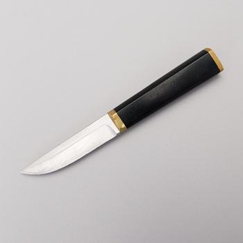 TAPIO WIRKKALA, PUUKKO-KNIV, rostfritt stål, nylon och mässing, Hackman Finland. Modellen formgiven 1961.