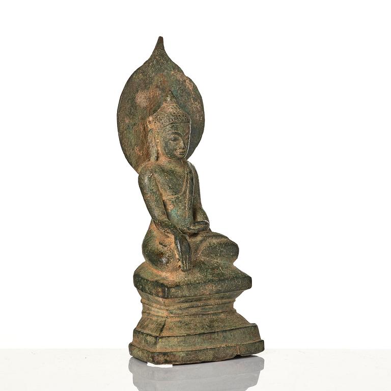 A bronze figure of Buddha with a halo, Burma, 16th century.