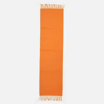 Hermès, a orange cashmere scarf.