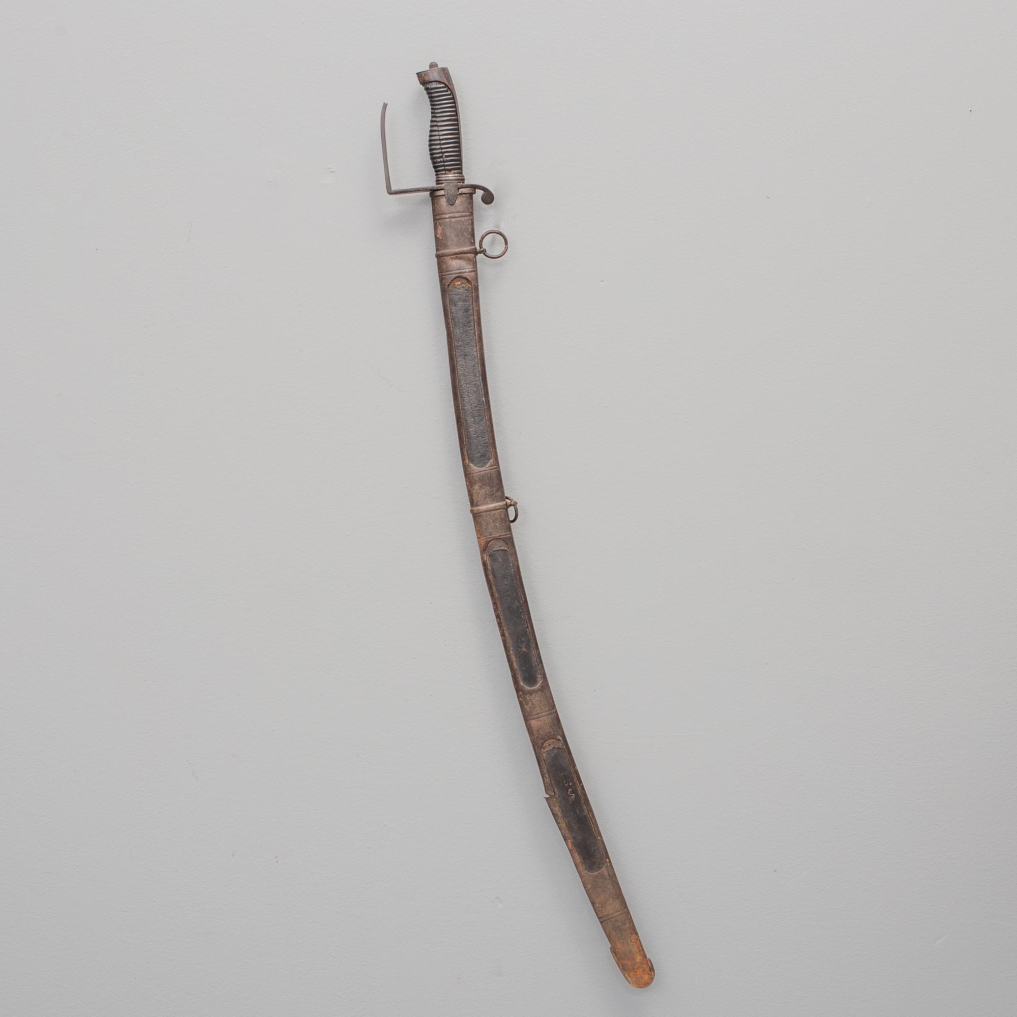 A british sabre with scabbard circa 1800.