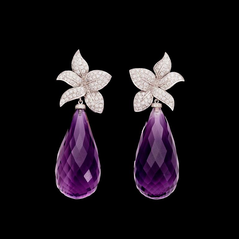 A pair of amethyst, tot. app. 9 cts, and brilliant cut diamond earrings, tot. 1.18 ct.