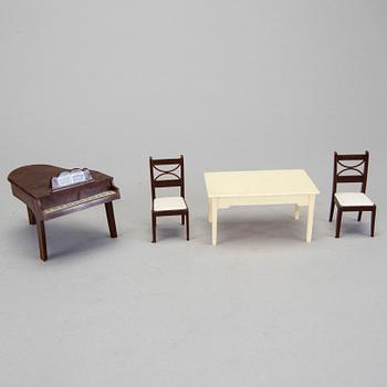 A lot of 26 pieces of plastic doll house furniture mostly by A Renwal products USA first half of the 20th century.