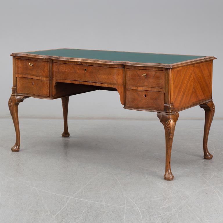 A Rococo-style circa 1900 writing desk.