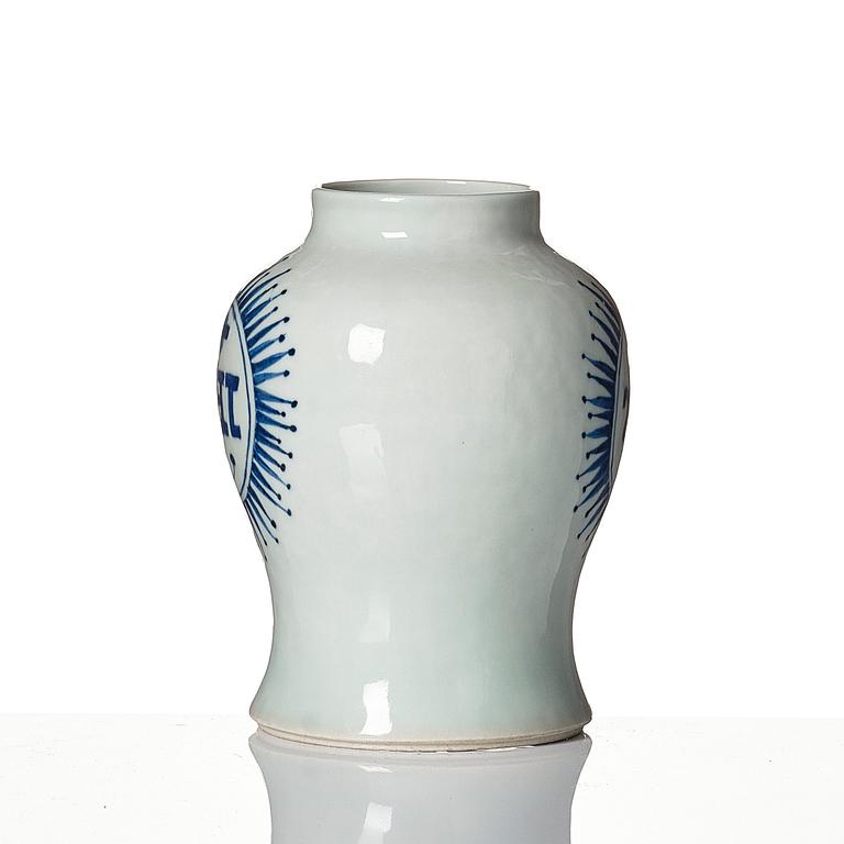 A small blue and white jar with the monogram IHS mirrored, Qing dynasty, 19th Century.