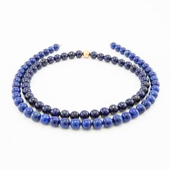 Ole Lynggaard, Necklace clasp in 18K gold with two necklaces of lapis lazuli, clasp design by Charlotte Lynggaard.