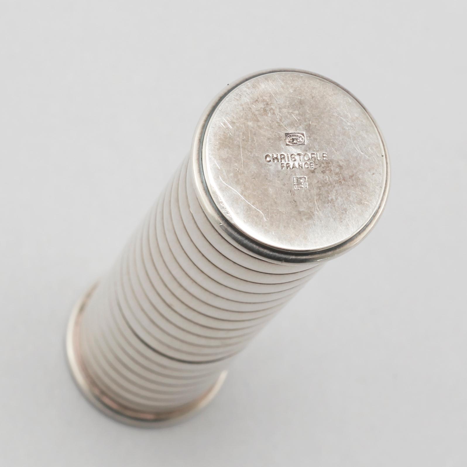 Three ligthers by Pierre Cardin, Ronson and Zippo and shopsticks and a scent bottle from Christofle.