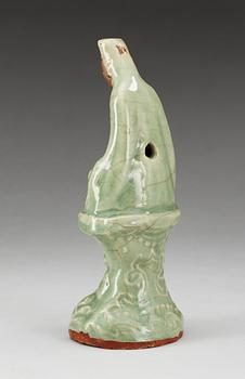 A celadon glazed figure of Guanyin, Ming dynasty.