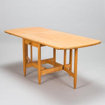 Eero Aarnio, A set of 6 "Pirtti" chairs and dining table for Laukaan Puu, Finland, late 20th century.