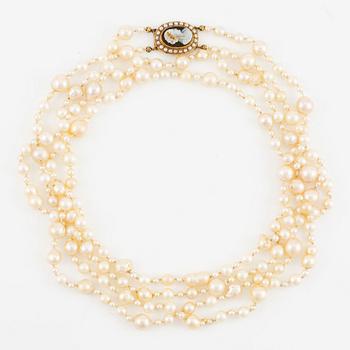 Necklace of two strands of cultured pearls, clasp 18K gold with a hardstone cameo.