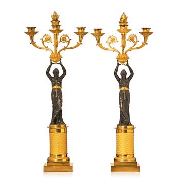 140. A pair of French Empire four-light candelabra, attributed to Francois Rabiat (bronze maker in Paris 1756-1815).