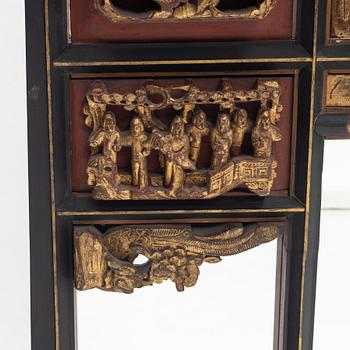 A Chinese gilt and lacquer wooden mirror, 20th century.