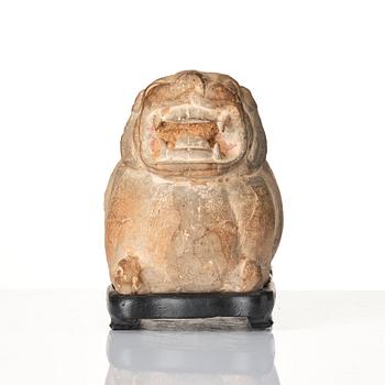 A pottery model of a recumant tiger/chimera, Han dynasty (206 BC-220 AD).