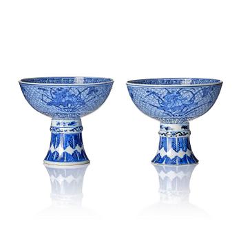 1049. A pair of blue and white stemcups, Qing dynasty with Guangxu mark.