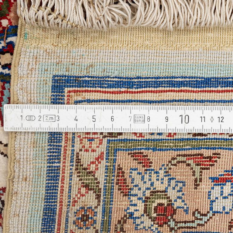 A silk Kayseri/Hereke carpet, c. 310 x 195 cm.