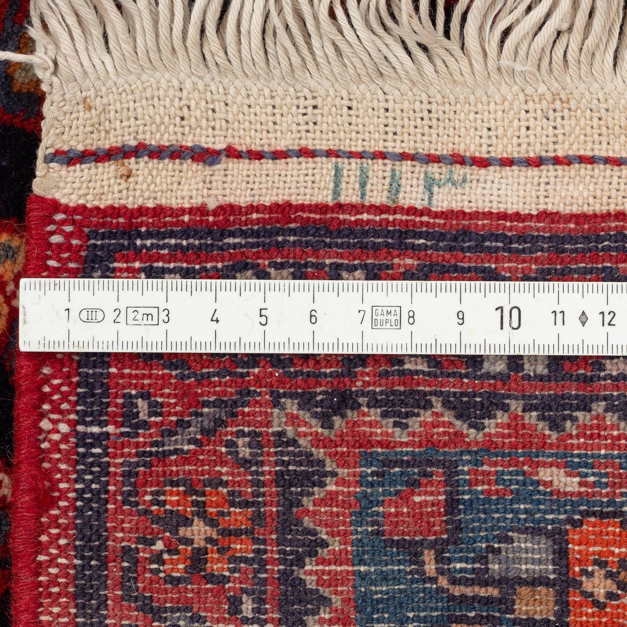 An oriental rug, old, c. 204 x 139 cm.