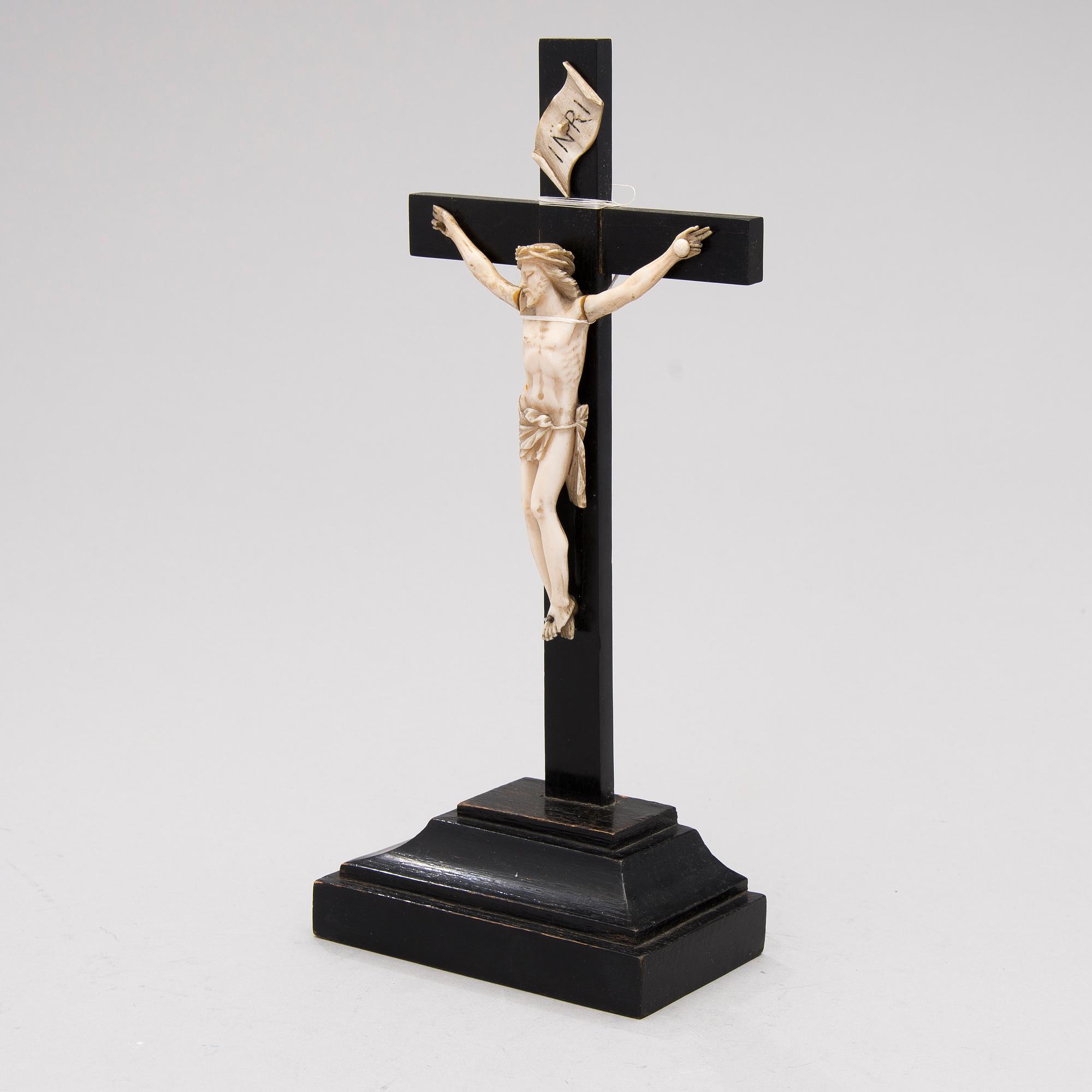 A WOODEN AND BONE TABLE CRUCIFIX with base. 19th Century.