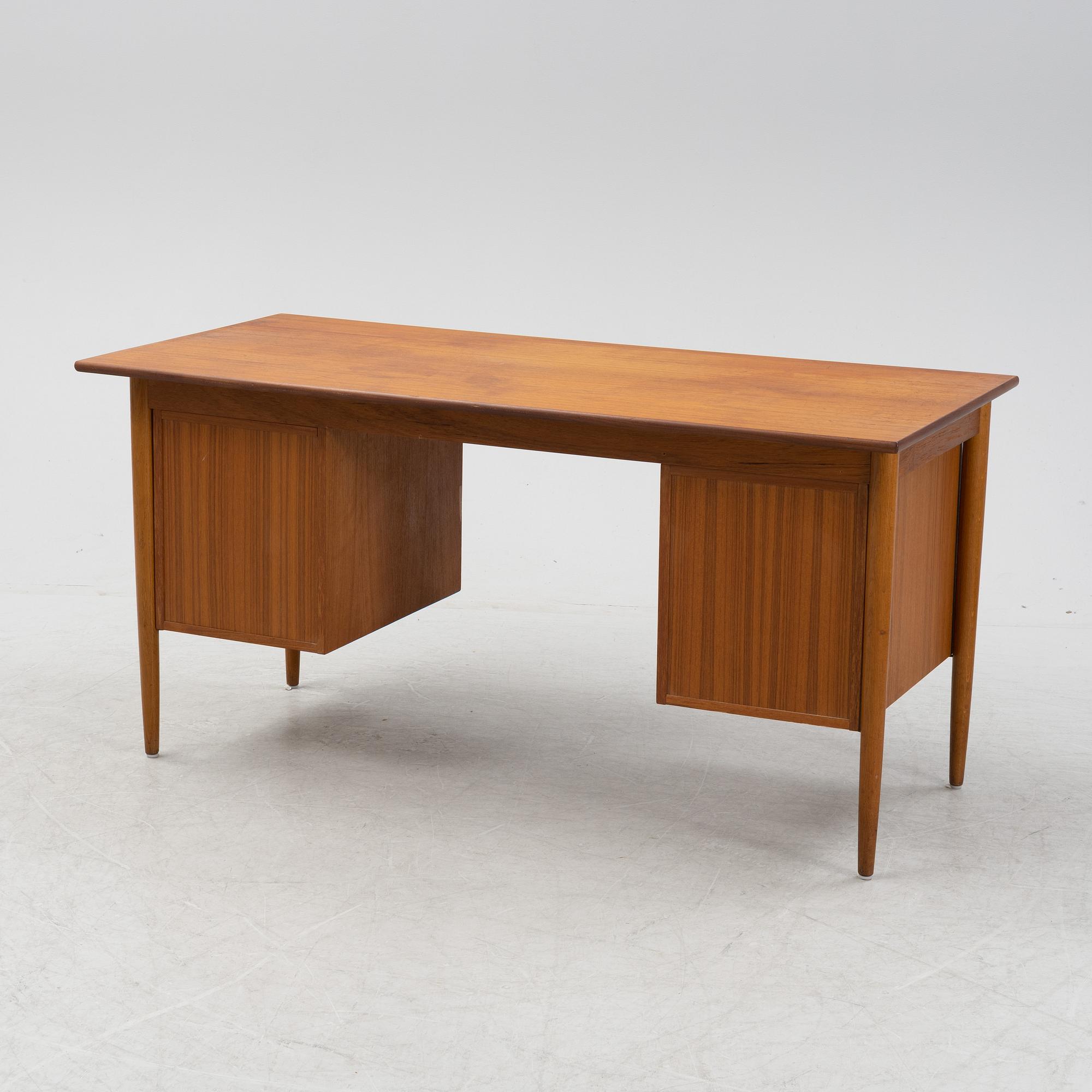 A teak veneered desk, 1950's/1960's.