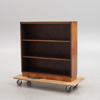 A 1930s wanlut and rosewood veneered  bookcase.