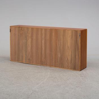 A 1960s walnut veneer wall cabinet.