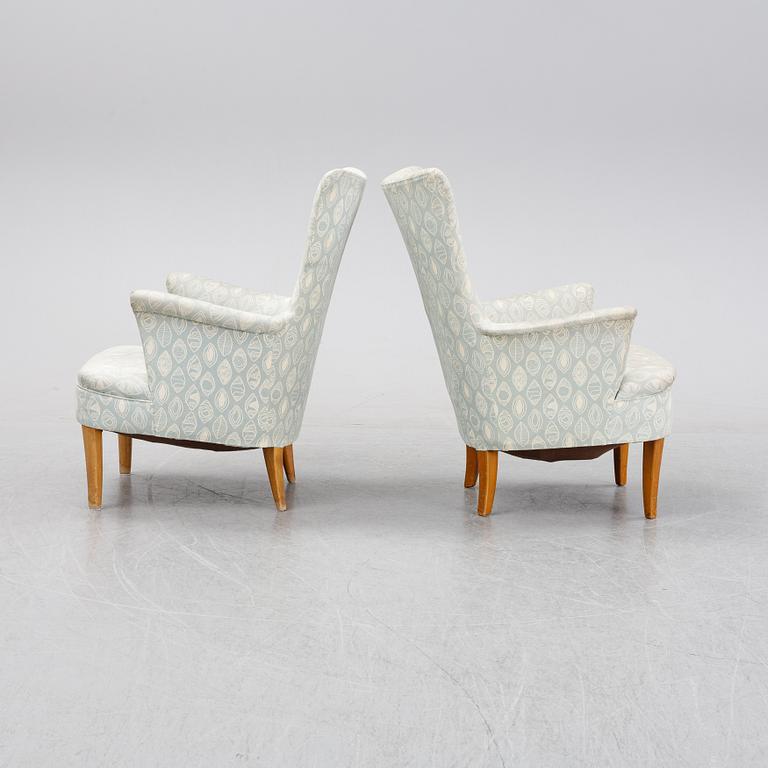 A pair of easy chairs by Carl Malmsten second half of the 20th Century.