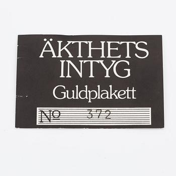 Plaque, 18K gold, numbered 372/1000, 1975, weight approx. 27 g.