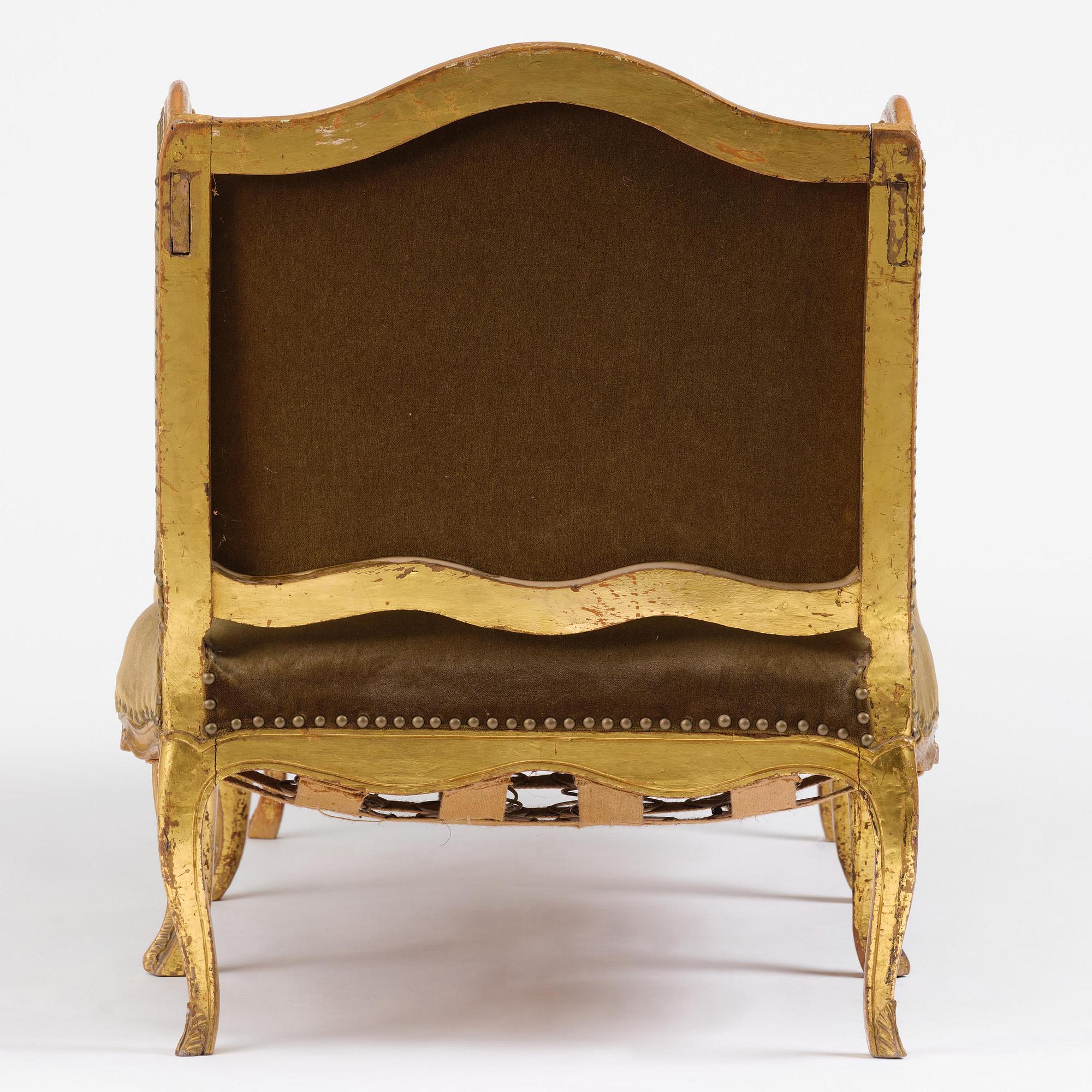 A French Louis Xv giltwood lit de repos, later part 18th century.