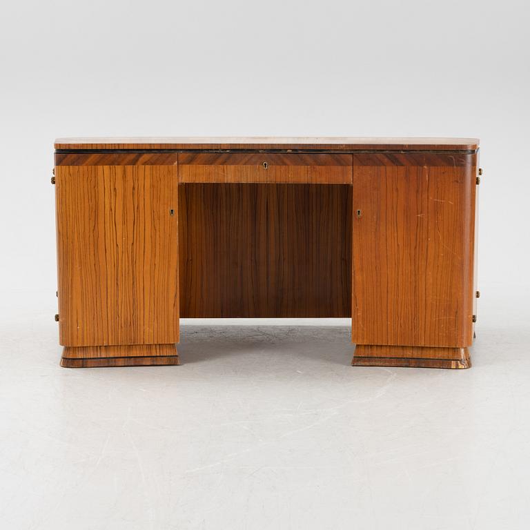 A zebrano veneered Swedish Modern desk, mid 20th Century.