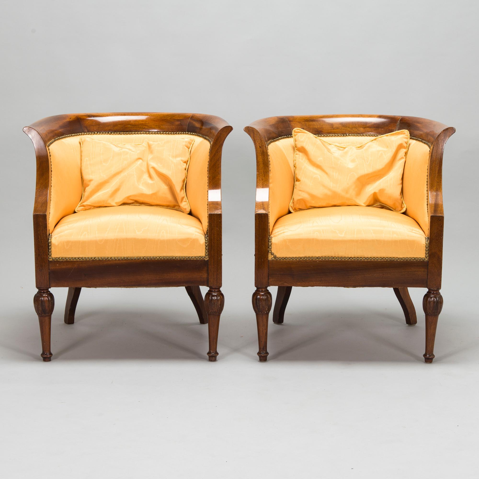Pair of mahogany and mahogany veneered armchairs, 1920-30s.