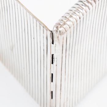 Cigarette case of silver with a cabochon-cut blue stone, first half of the 20th century.