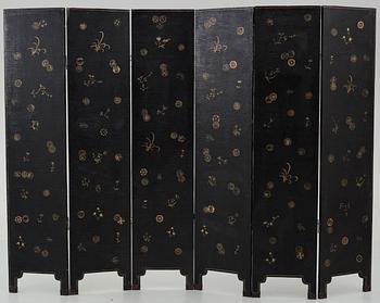 A six panel lacquer screen, Qing dynasty (1644-1911).