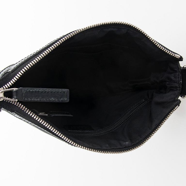 Gucci, a "Techno Canvas Web Messenger" bag.