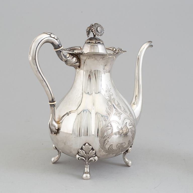 A 3 part silver coffee service dated 1937.